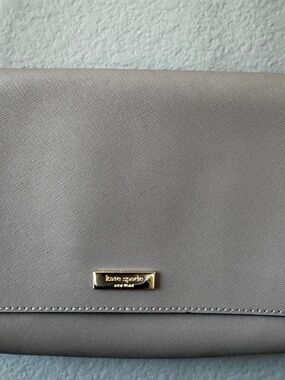kate spade gray saffiano leather clutch with gold plaque